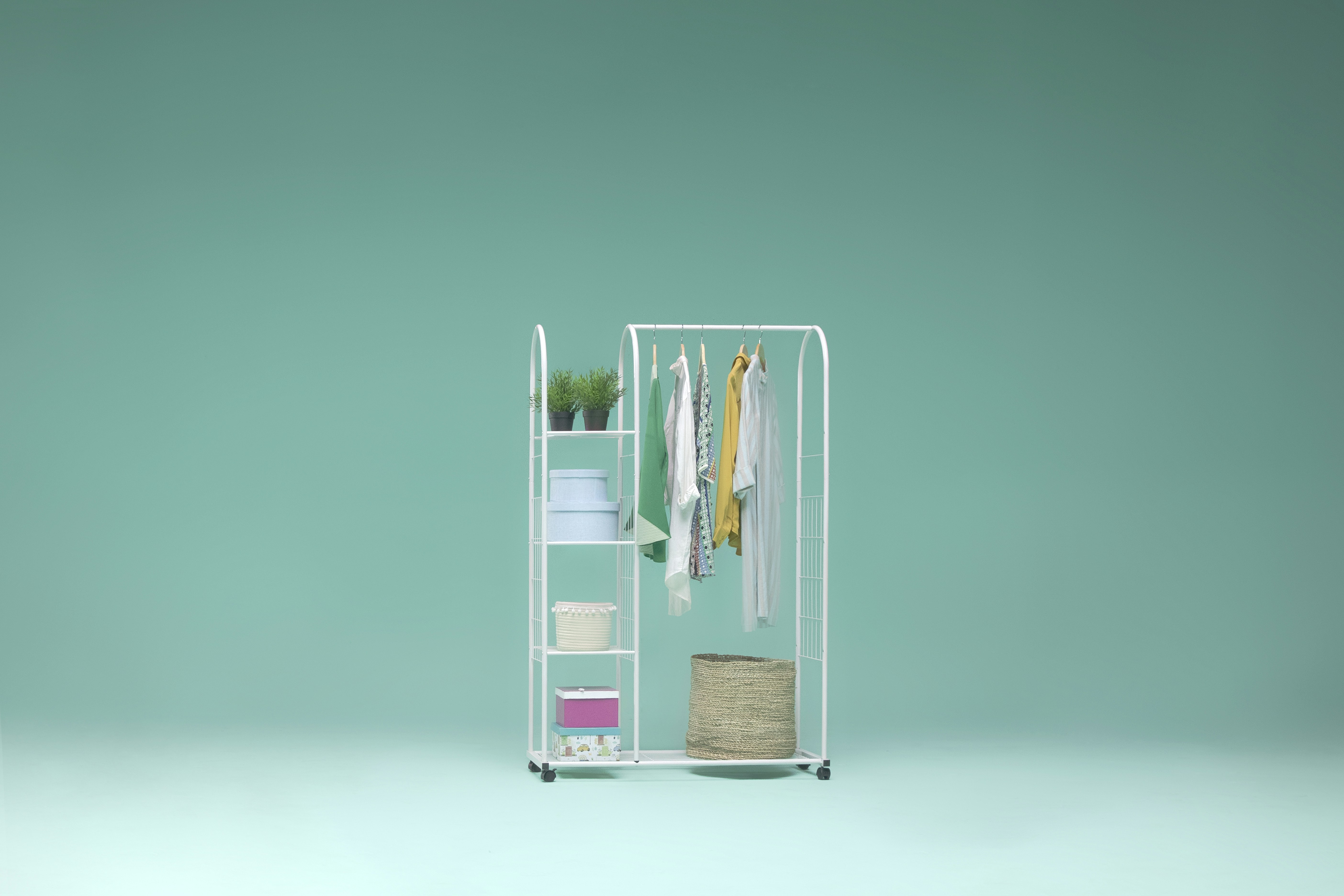 a rack with clothes and a hat on it